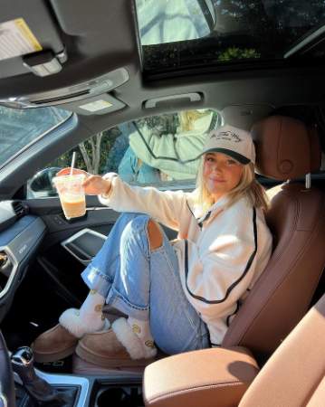 Sidney Tilton chilling in her car.